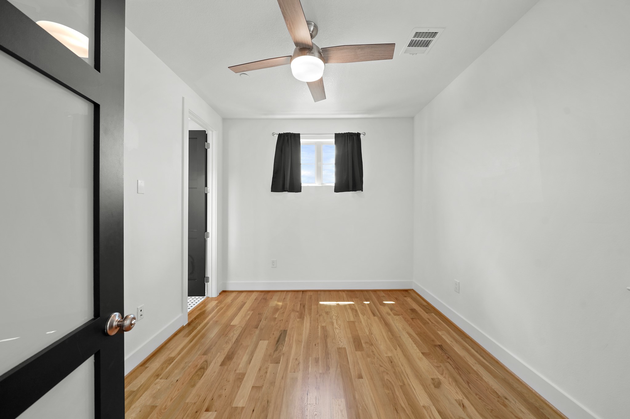 5343 Larkin Street Houston, TX 77007 - Photo 12 of 21 a view of kitchen with wooden floor and ceiling fan