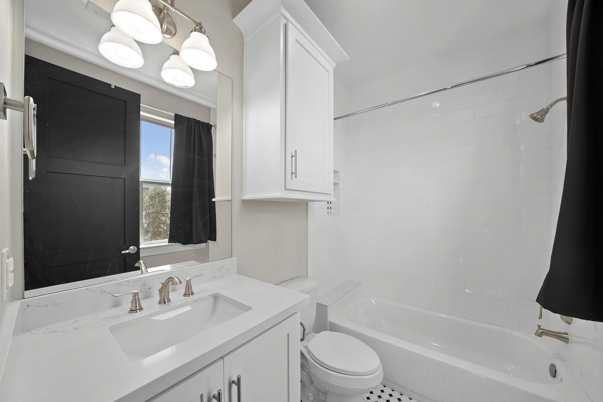 5343 Larkin Street Houston, TX 77007 - Photo 13 of 21 a bathroom with a sink a toilet and bathtub