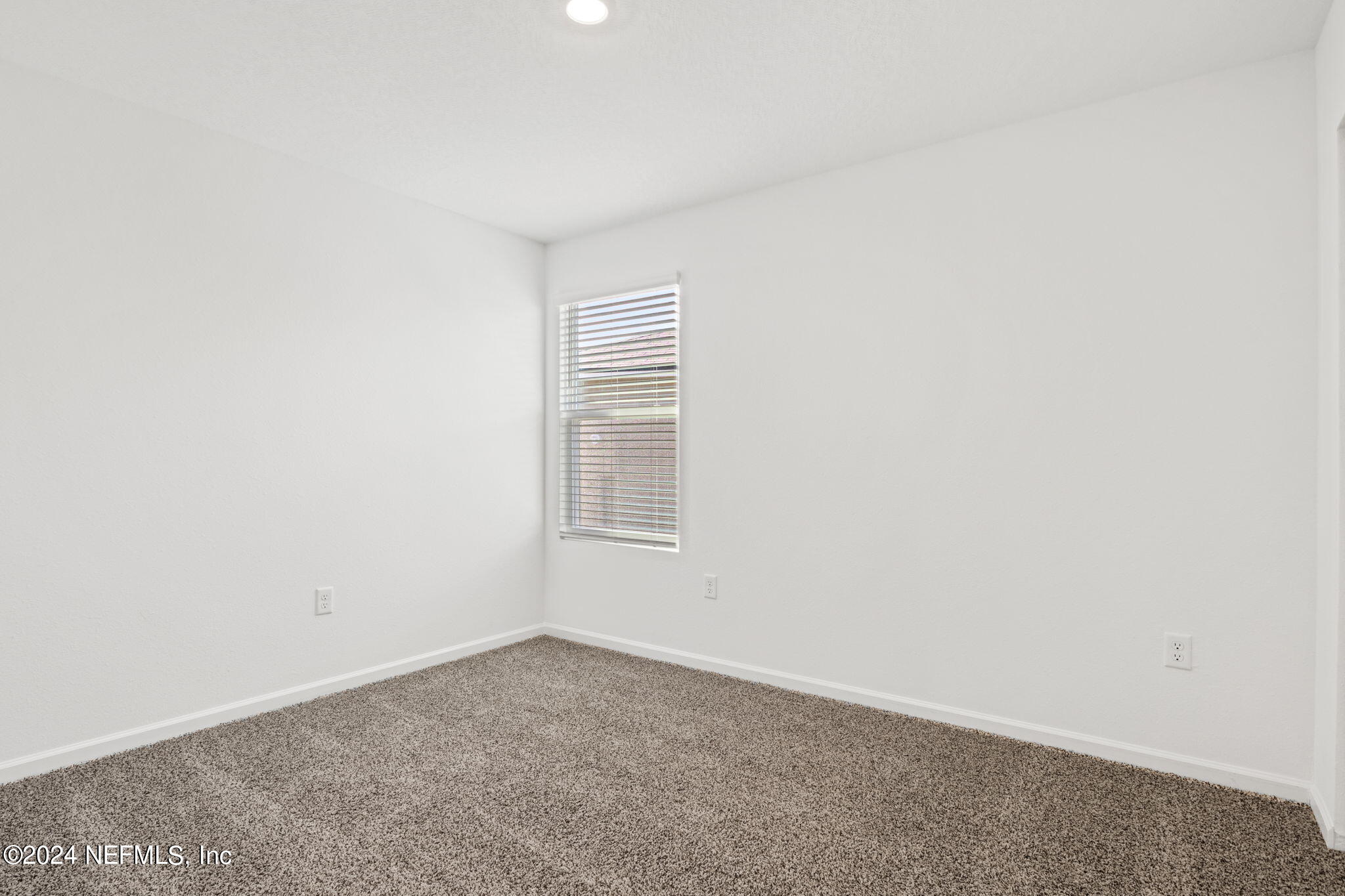12567 Rubber Fig Terrace Jacksonville, FL 32218 - Photo 12 of 21 a view of a room that has a window in it