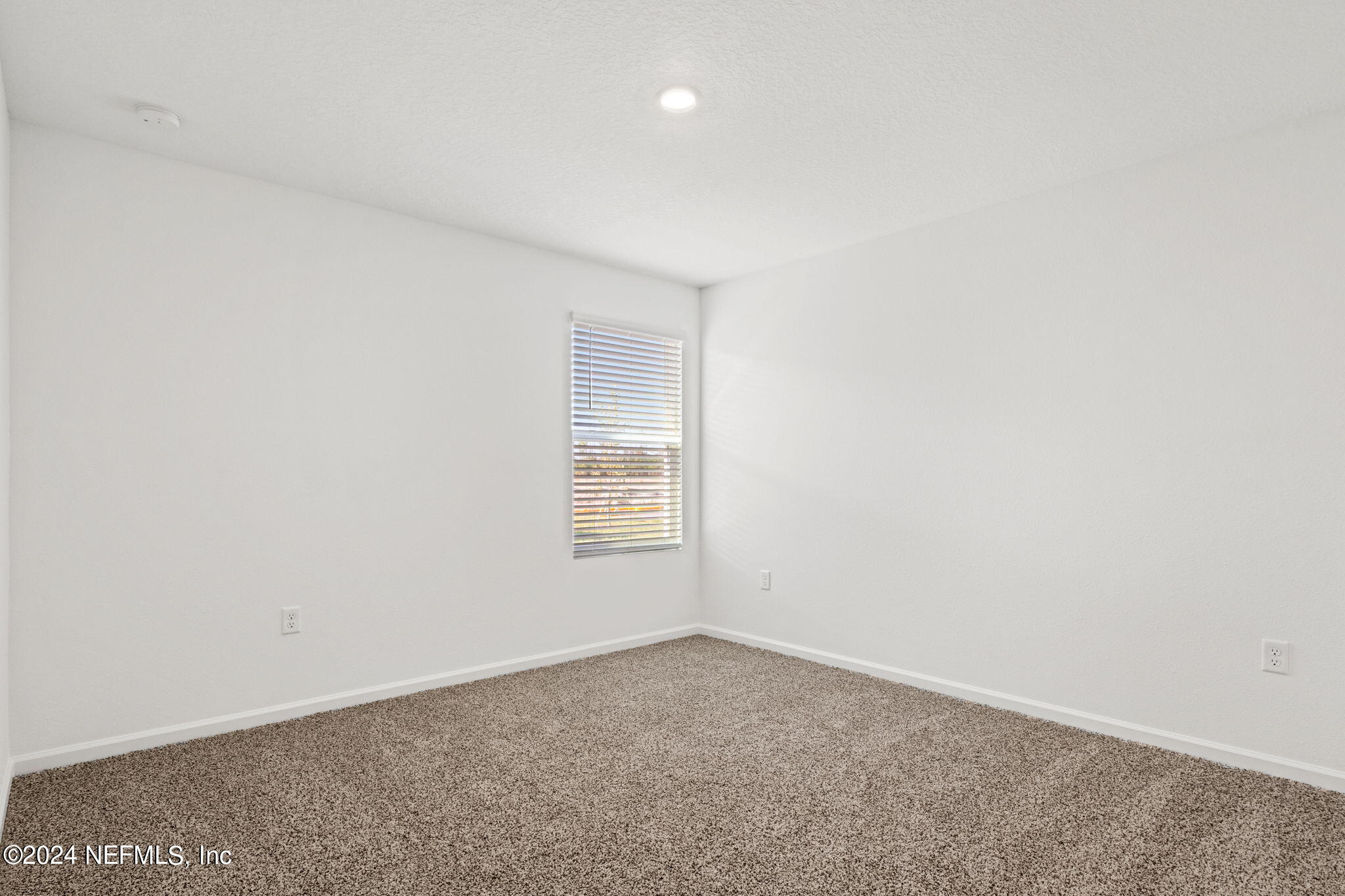 12567 Rubber Fig Terrace Jacksonville, FL 32218 - Photo 13 of 21 an empty room with a window