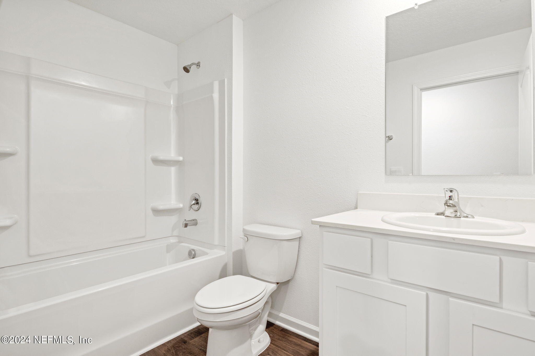 12567 Rubber Fig Terrace Jacksonville, FL 32218 - Photo 14 of 21 a bathroom with a sink a toilet and a bathtub
