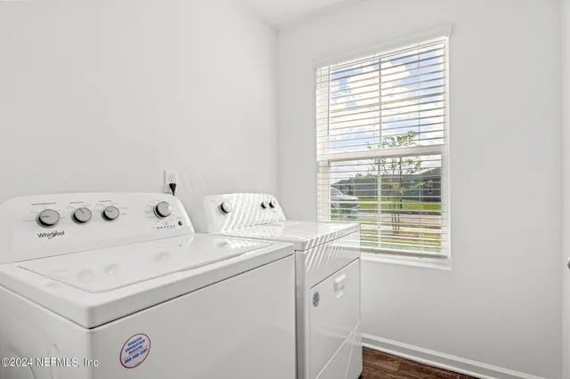 a utility room with dryer and washer