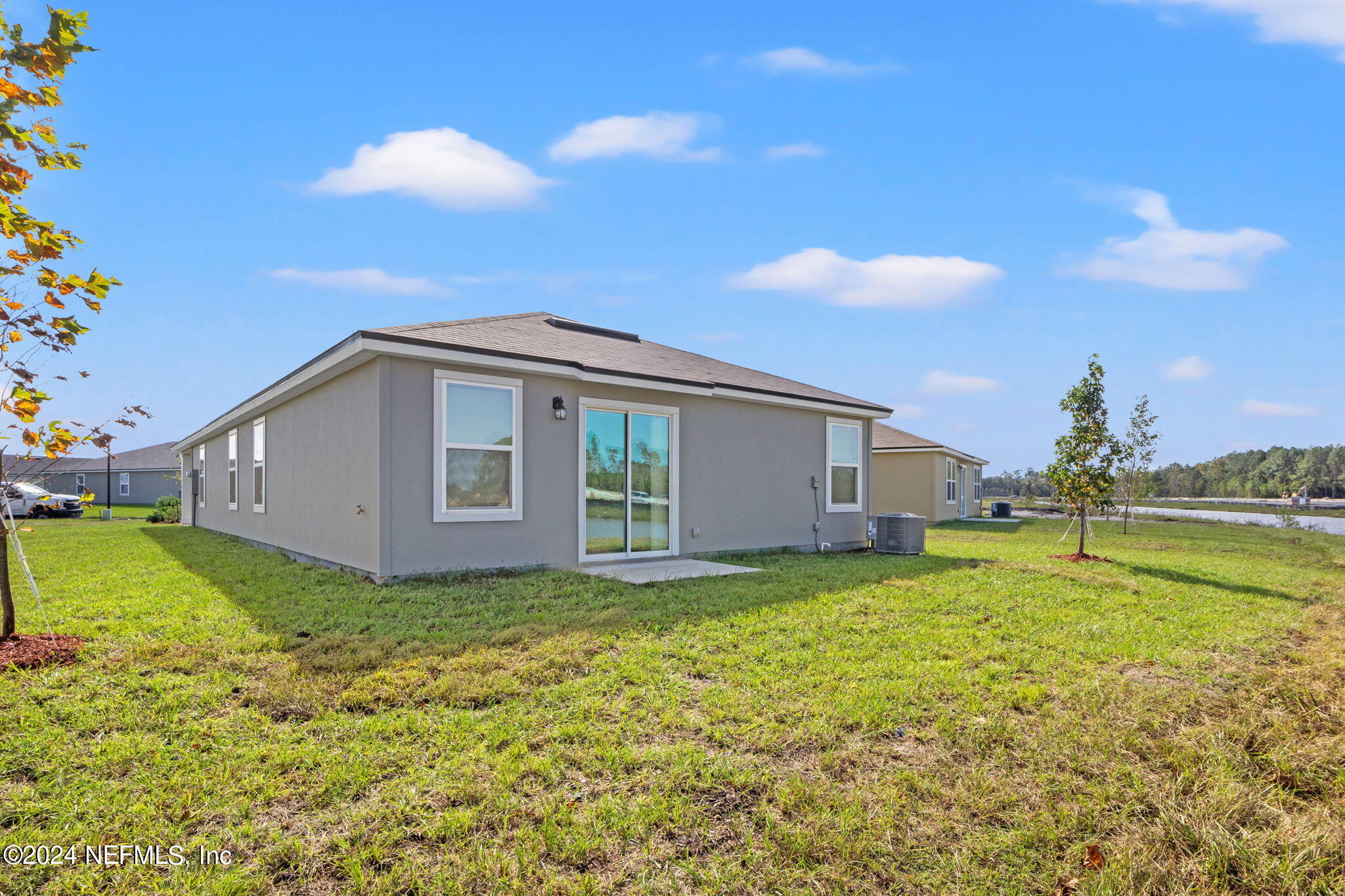 12567 Rubber Fig Terrace Jacksonville, FL 32218 - Photo 16 of 21 a view of a house with a yard