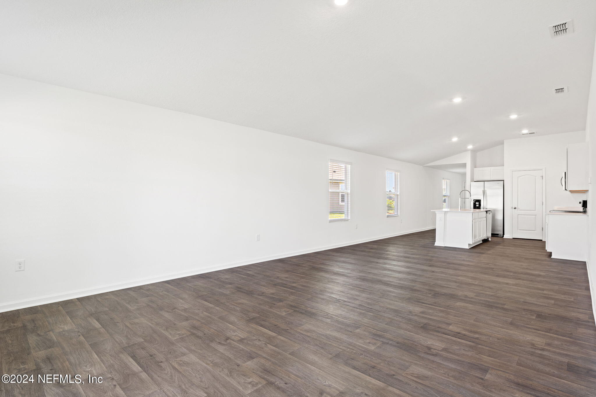 12567 Rubber Fig Terrace Jacksonville, FL 32218 - Photo 7 of 21 a view of empty room with wooden floor