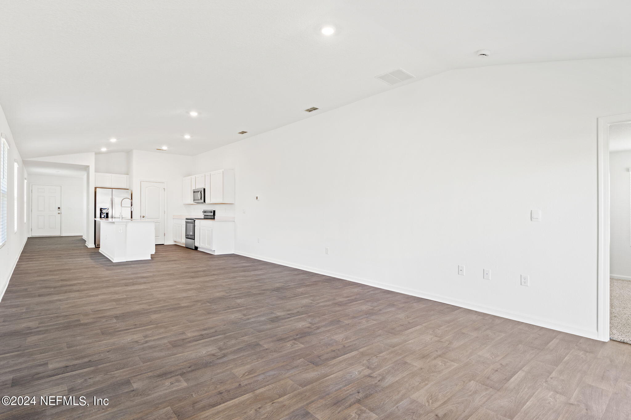 12567 Rubber Fig Terrace Jacksonville, FL 32218 - Photo 8 of 21 a view of empty room with wooden floor