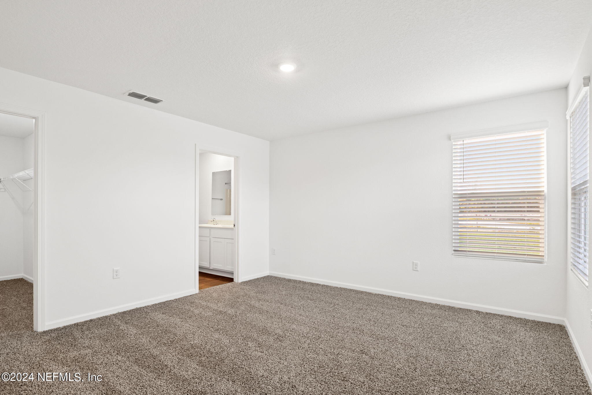 12567 Rubber Fig Terrace Jacksonville, FL 32218 - Photo 9 of 21 a view of an empty room with a window