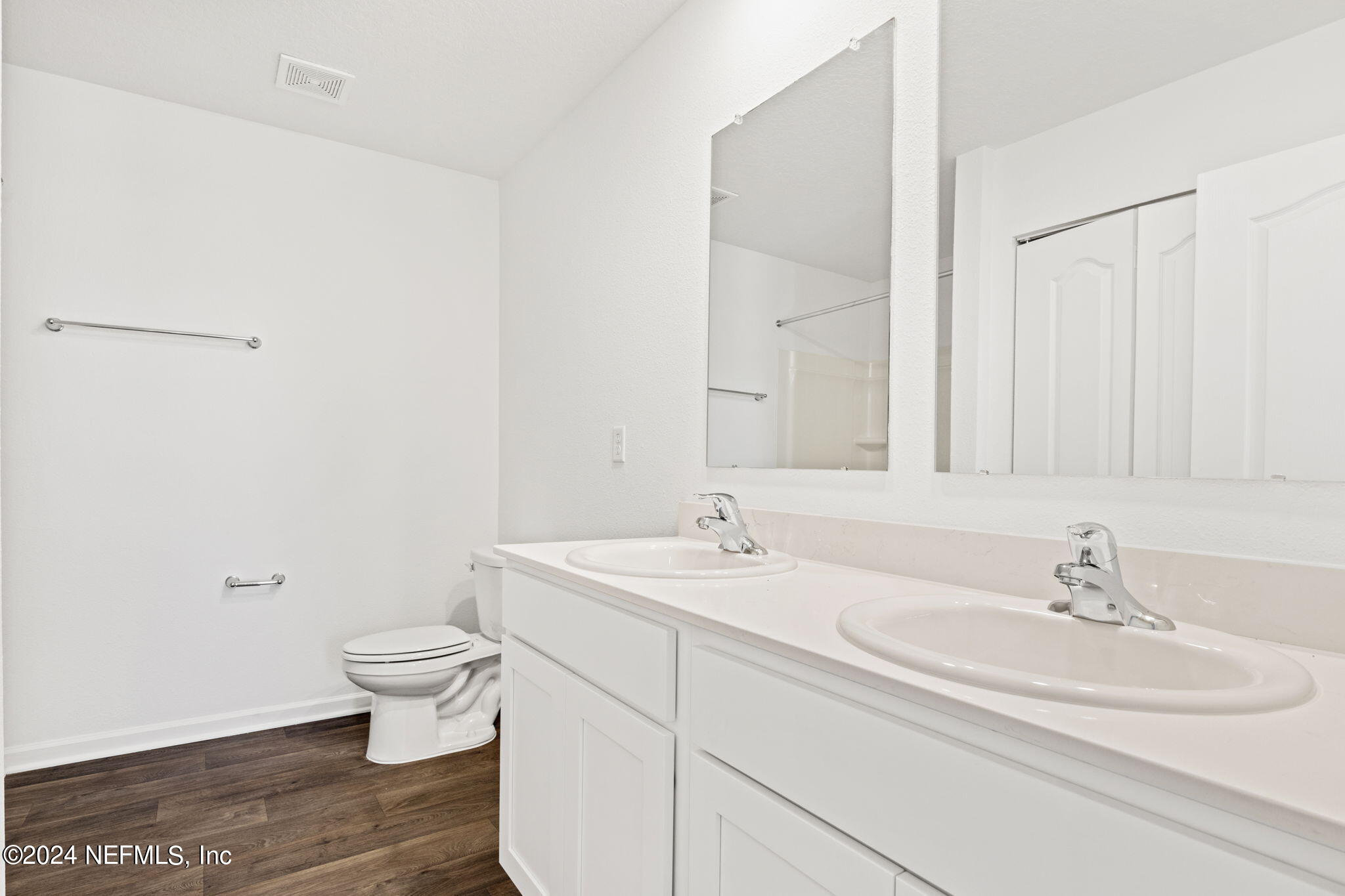 12567 Rubber Fig Terrace Jacksonville, FL 32218 - Photo 10 of 21 a bathroom with a sink and a mirror