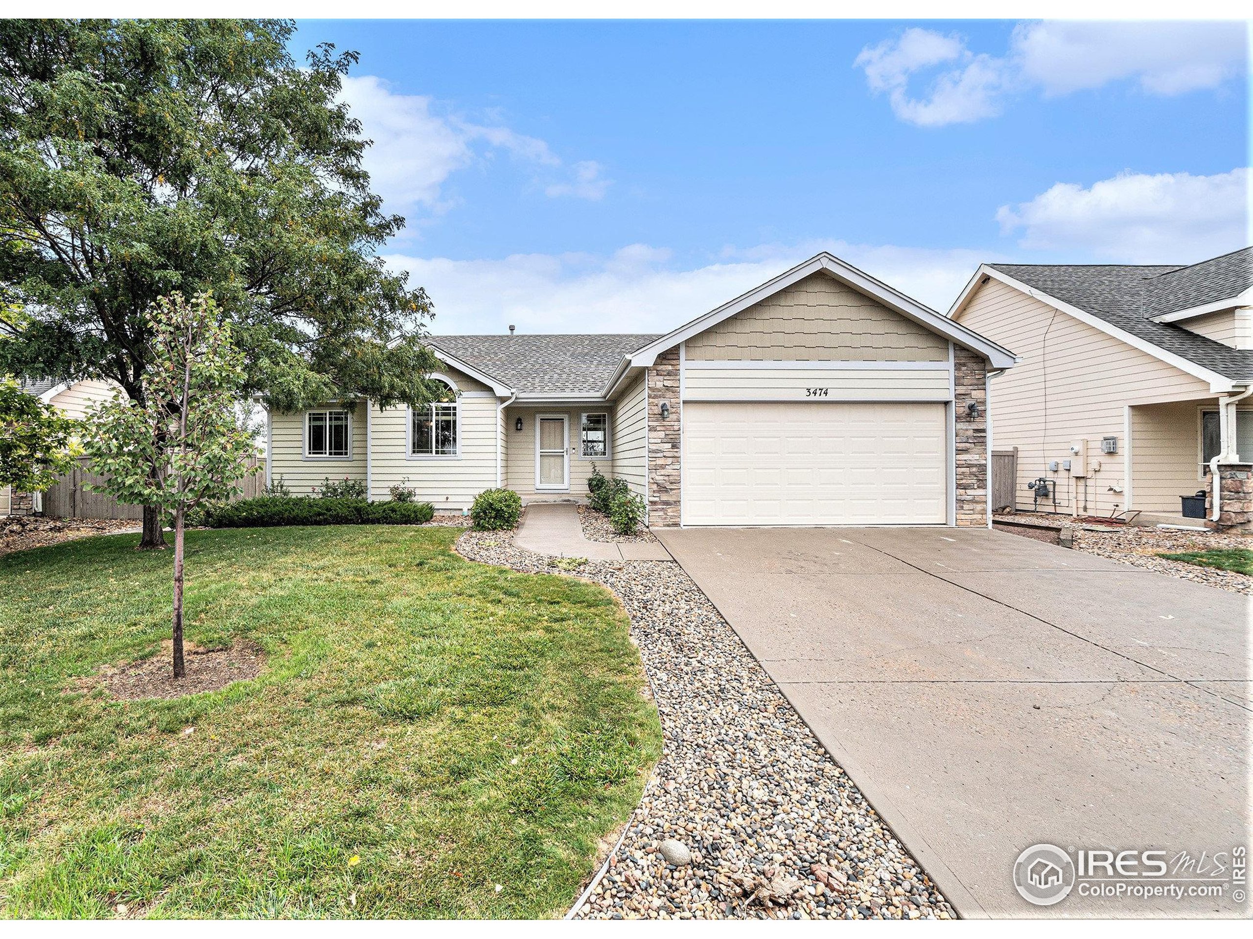 3474 Iron Horse Way Wellington, CO 80549 - Photo 1 of 20 a view of a house with a yard