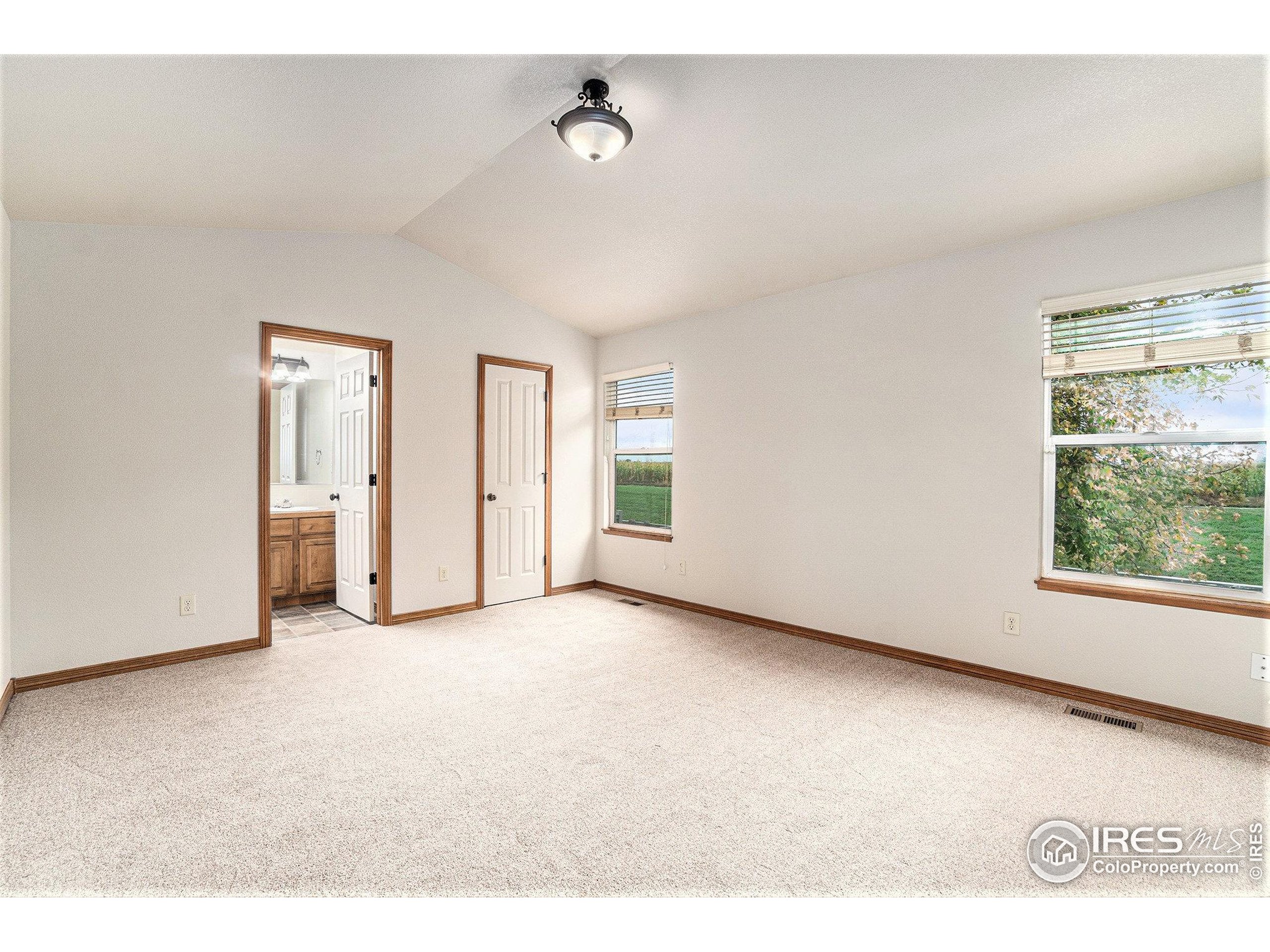 3474 Iron Horse Way Wellington, CO 80549 - Photo 9 of 20 a view of an empty room with a window
