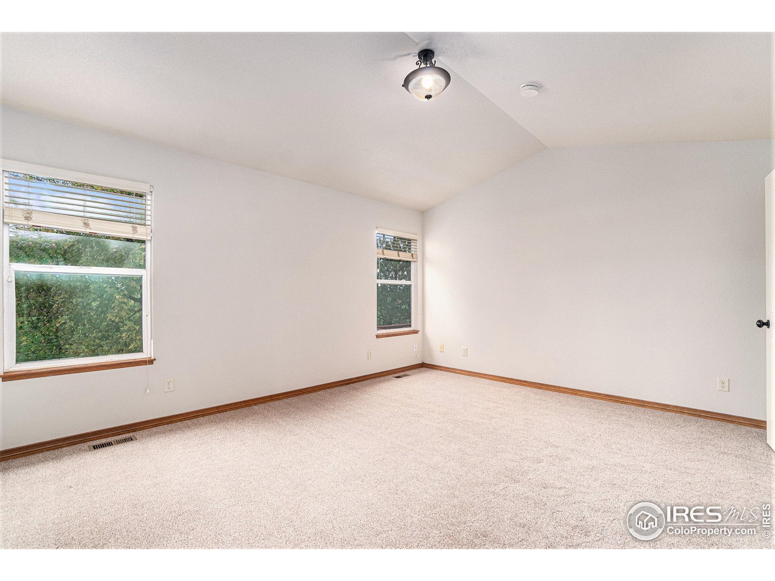 3474 Iron Horse Way Wellington, CO 80549 - Photo 10 of 20 a view of an empty room with a window
