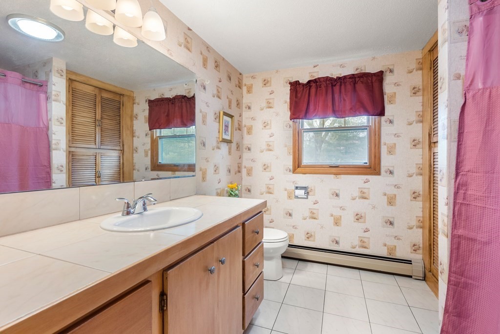 575 Piper Road West Springfield, MA 01089 - Photo 23 of 40 a bathroom with a sink a vanity and a mirror