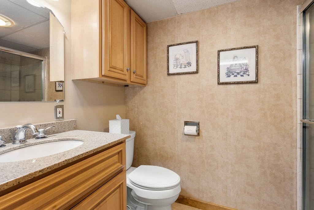 575 Piper Road West Springfield, MA 01089 - Photo 24 of 40 a bathroom with a granite countertop toilet and a sink