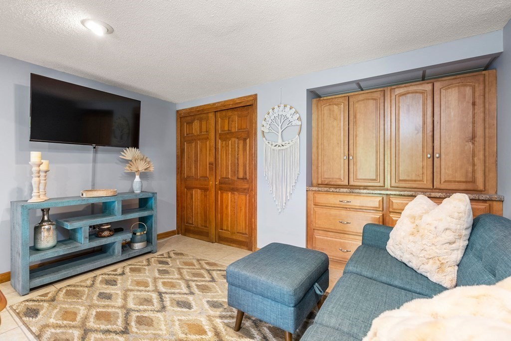 575 Piper Road West Springfield, MA 01089 - Photo 25 of 40 a living room with furniture and a flat screen tv