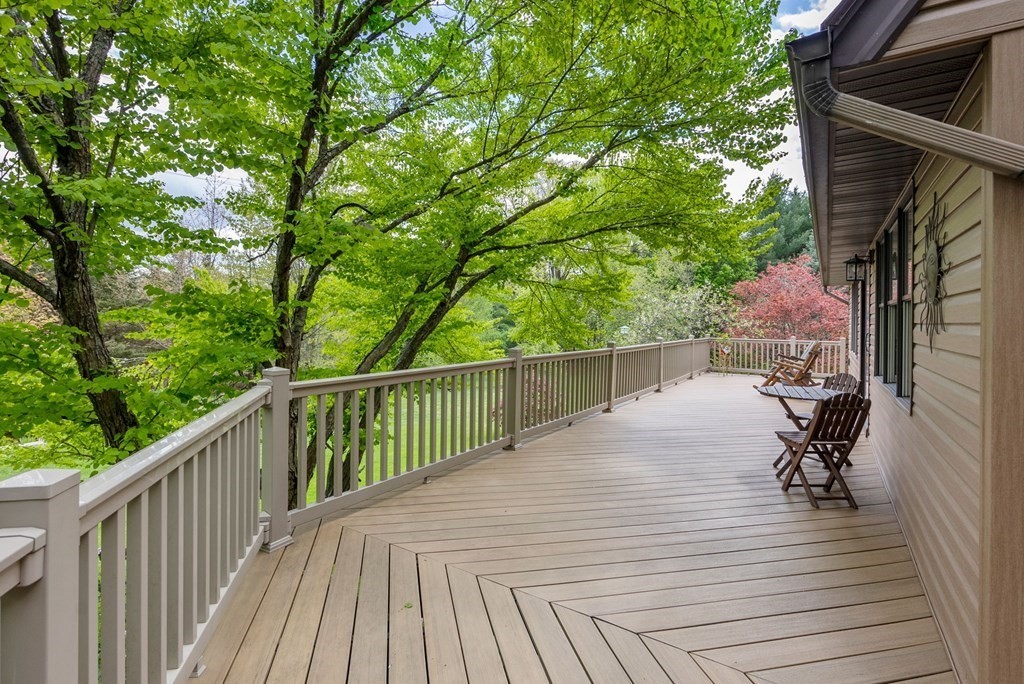 575 Piper Road West Springfield, MA 01089 - Photo 29 of 40 a balcony with wooden floor table and chairs