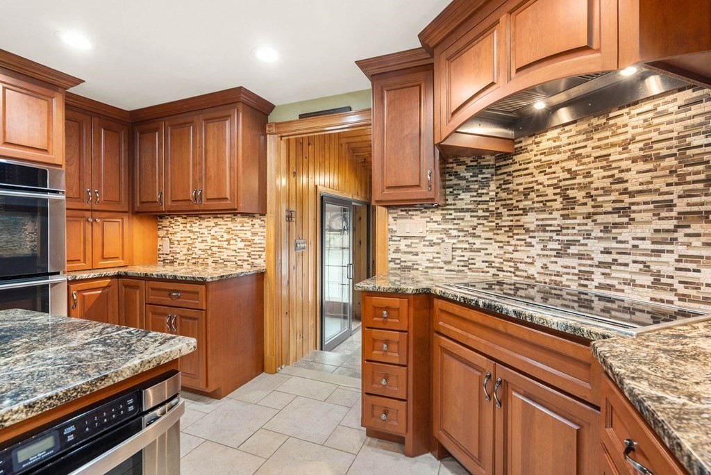 575 Piper Road West Springfield, MA 01089 - Photo 4 of 40 a kitchen with stainless steel appliances granite countertop a stove a sink and a microwave