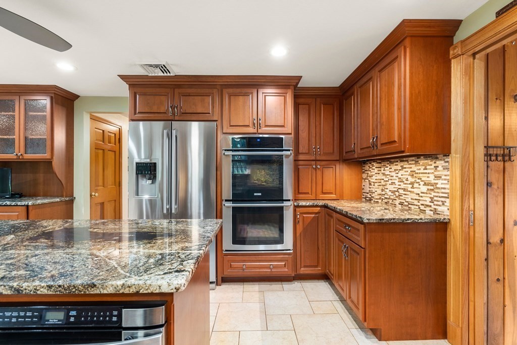 575 Piper Road West Springfield, MA 01089 - Photo 6 of 40 a kitchen with granite countertop a refrigerator and a sink