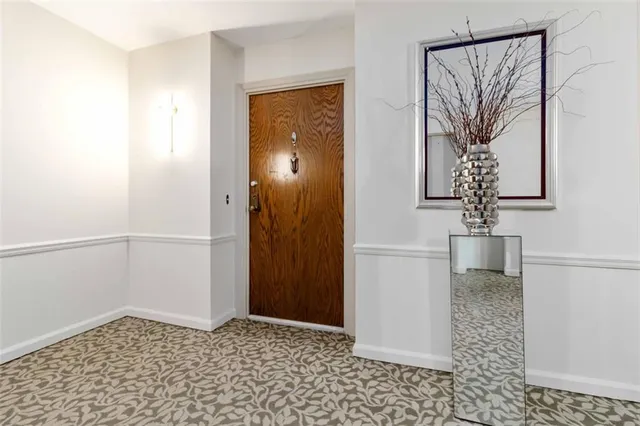 a view of a hallway with a window