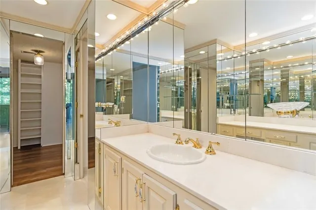 a bathroom with a sink and a large mirror