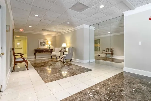 a view of a lobby area with living room and furniture