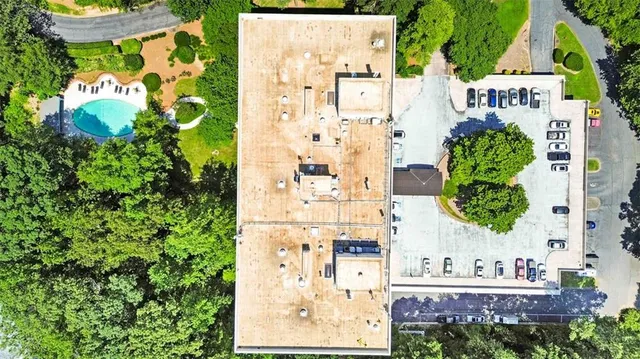 a aerial view of a house with yard and outdoor seating