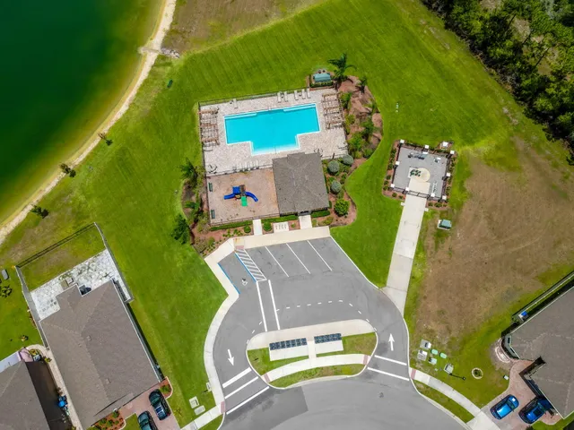 an aerial view of a house with a swimming pool