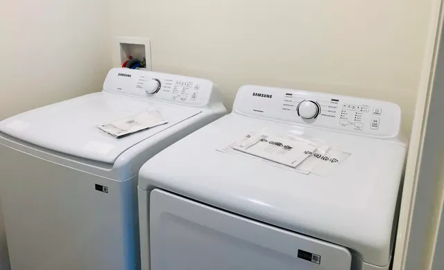 a utility room with dryer and washer
