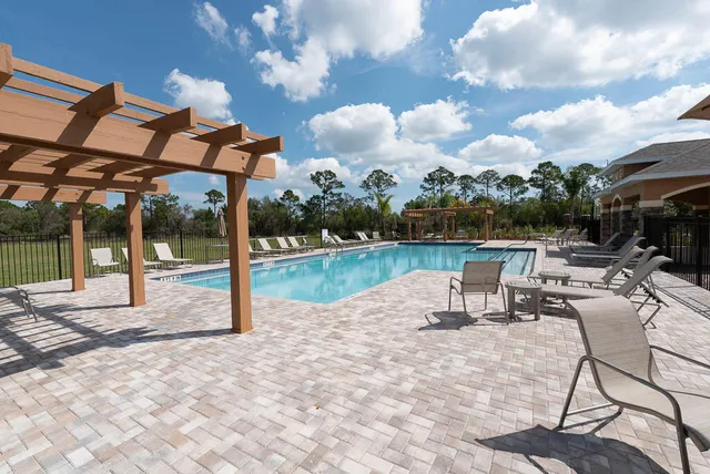 a view of a swimming pool with a patio