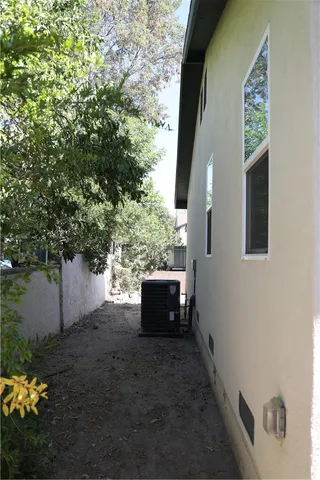 a backyard of a house with outdoor seating