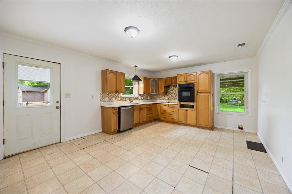 571 South 1st Street Point, TX 75472 - Photo 9 of 27 a large white kitchen with a stove a sink dishwasher and a refrigerator