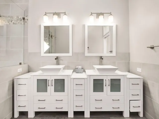 a kitchen with stainless steel appliances kitchen island a white cabinets and sink