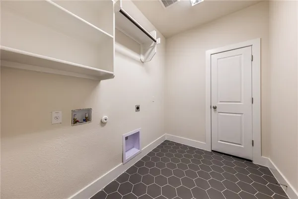 a view of a living room with furniture and wooden floor