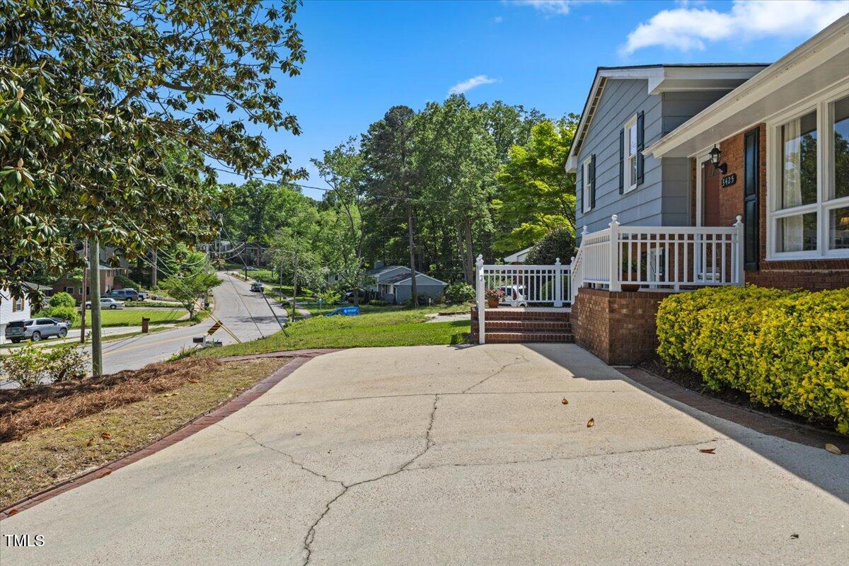 3425 Brentwood Road Raleigh, NC 27604 - Photo 4 of 51 a view of a house with a yard