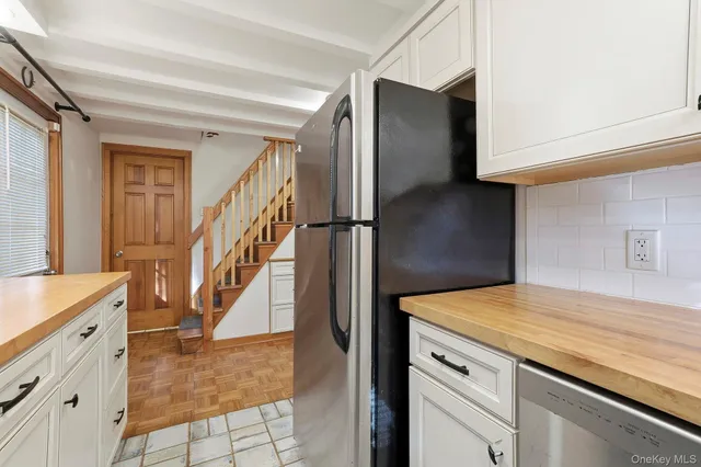 a view of a kitchen cabinets and entryway