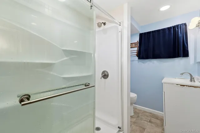 a view of a storage and utility room with a refrigerator