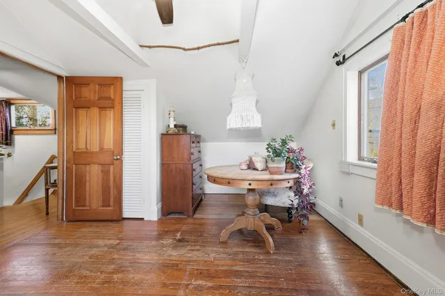 a workspace with furniture window and wooden floor