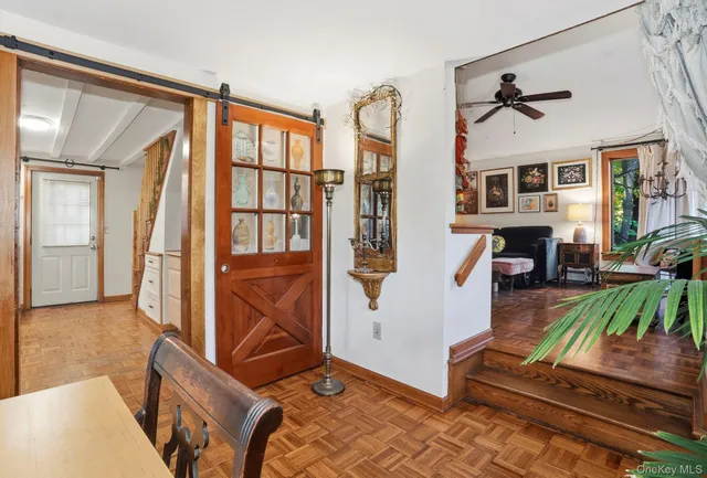 a living room with patio furniture and a fireplace