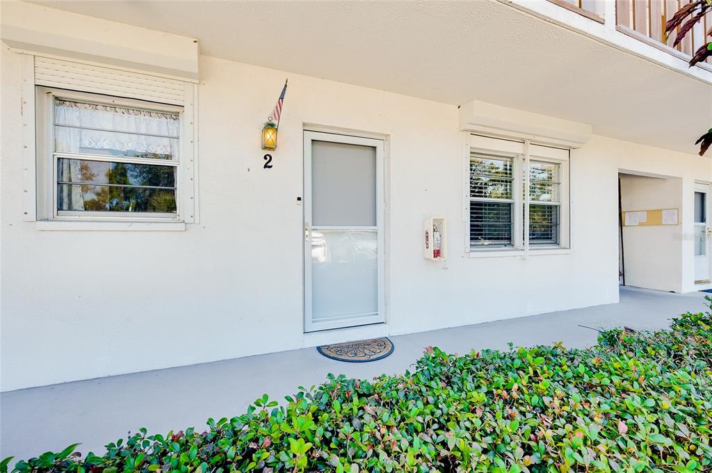 1 Quails Run Boulevard, Unit 2 Englewood, FL 34223 - Photo 1 of 1 front view of a house with a yard