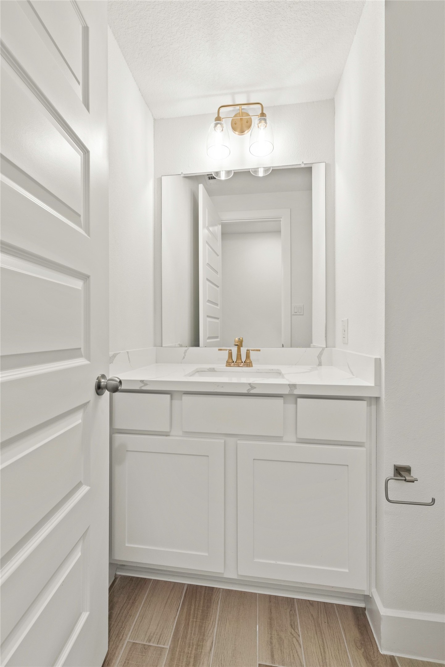 18917 Moonriver Street Conroe, TX 77302 - Photo 13 of 28 a bathroom with a sink vanity and mirror