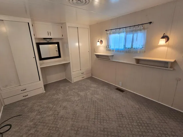 a kitchen with granite countertop a refrigerator and a stove