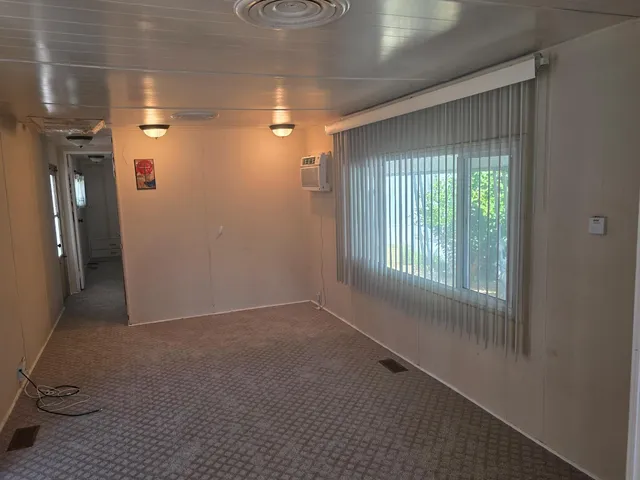 a view of hallway with windows