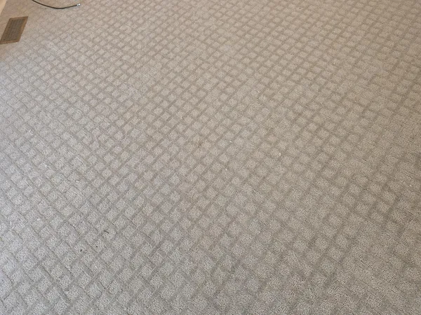 a bathroom with a white wall
