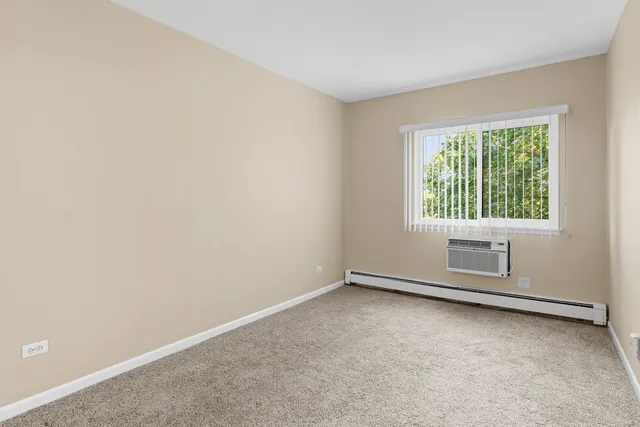 an empty room with closet area