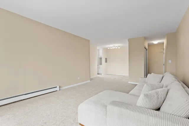 a large white bed in a white room