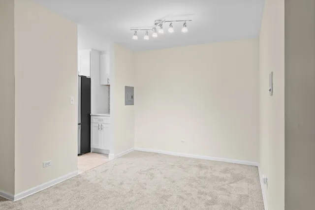 a kitchen with a sink stove and refrigerator
