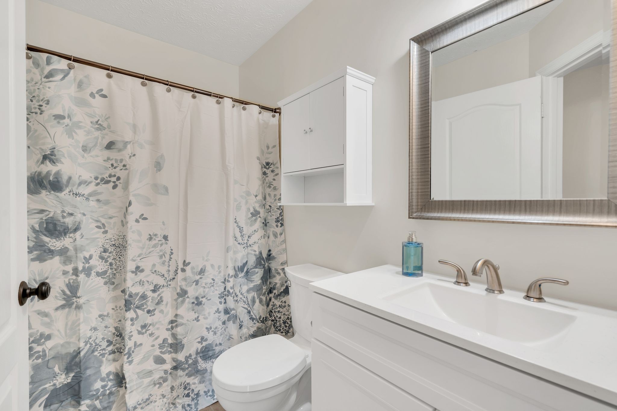 1365 Campbell Ridge Road Kingston Springs, TN 37082 - Photo 13 of 28 a bathroom with a sink a toilet and a mirror