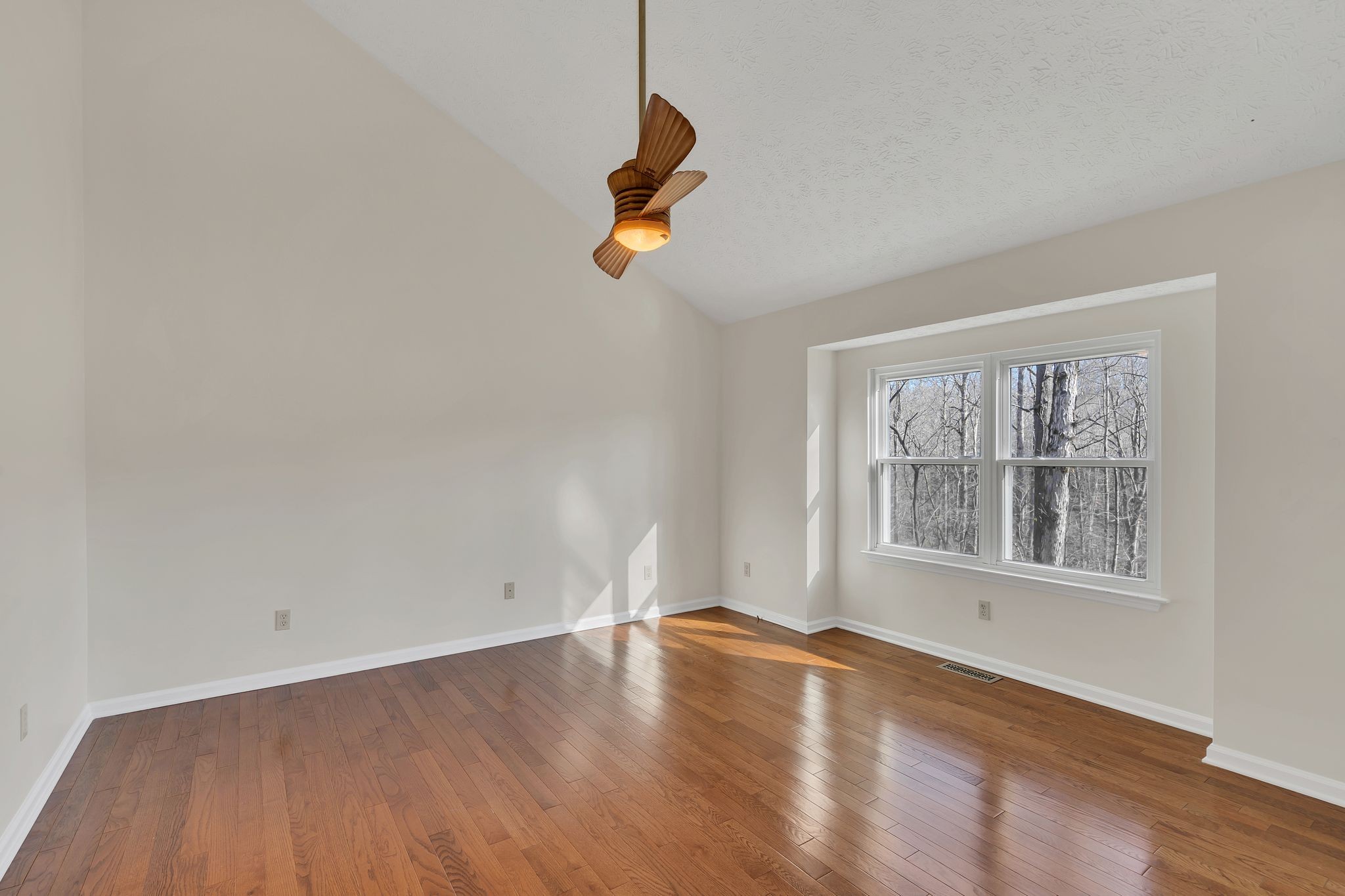 1365 Campbell Ridge Road Kingston Springs, TN 37082 - Photo 15 of 28 an empty room with wooden floor and windows