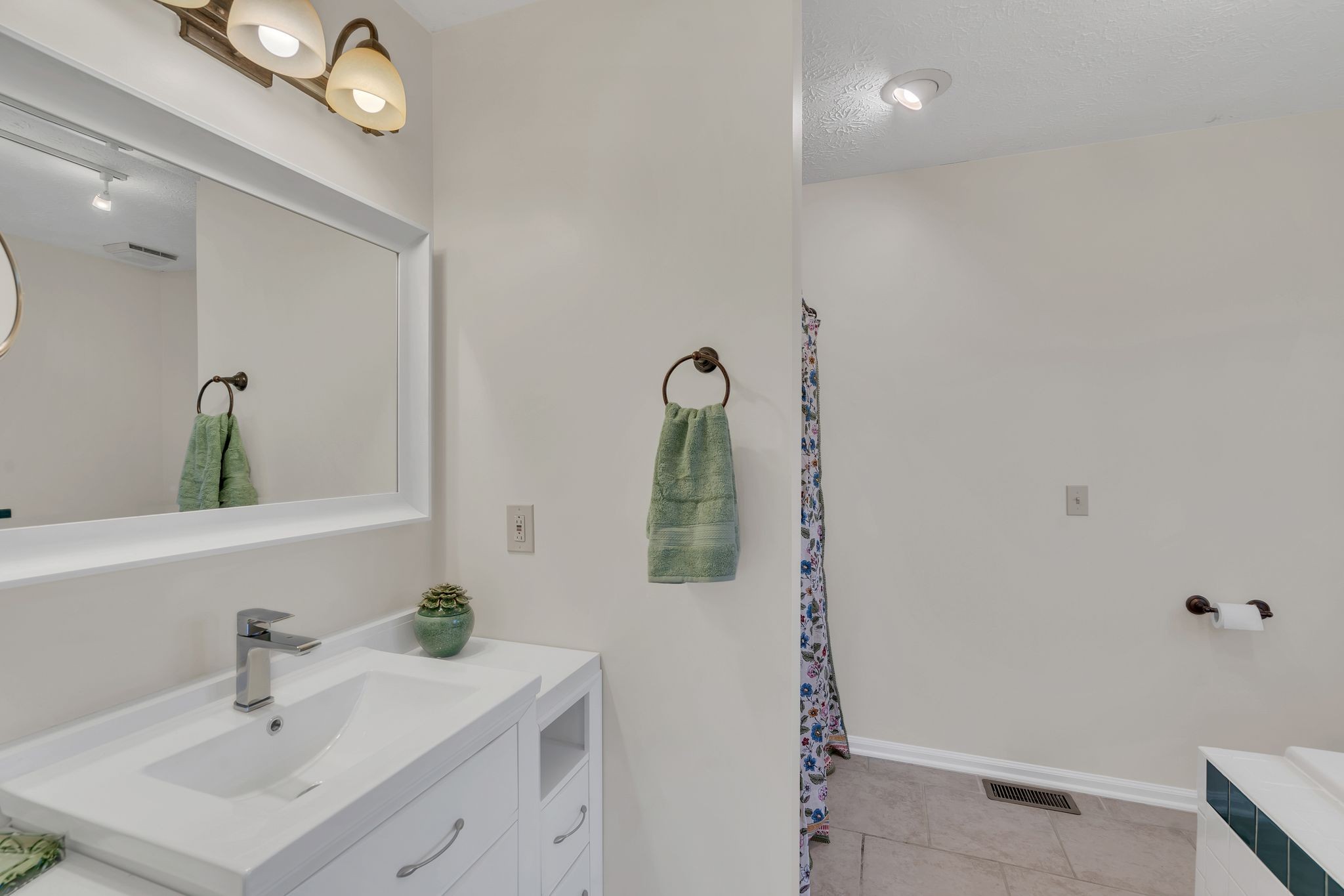1365 Campbell Ridge Road Kingston Springs, TN 37082 - Photo 17 of 28 a bathroom with a sink and a mirror