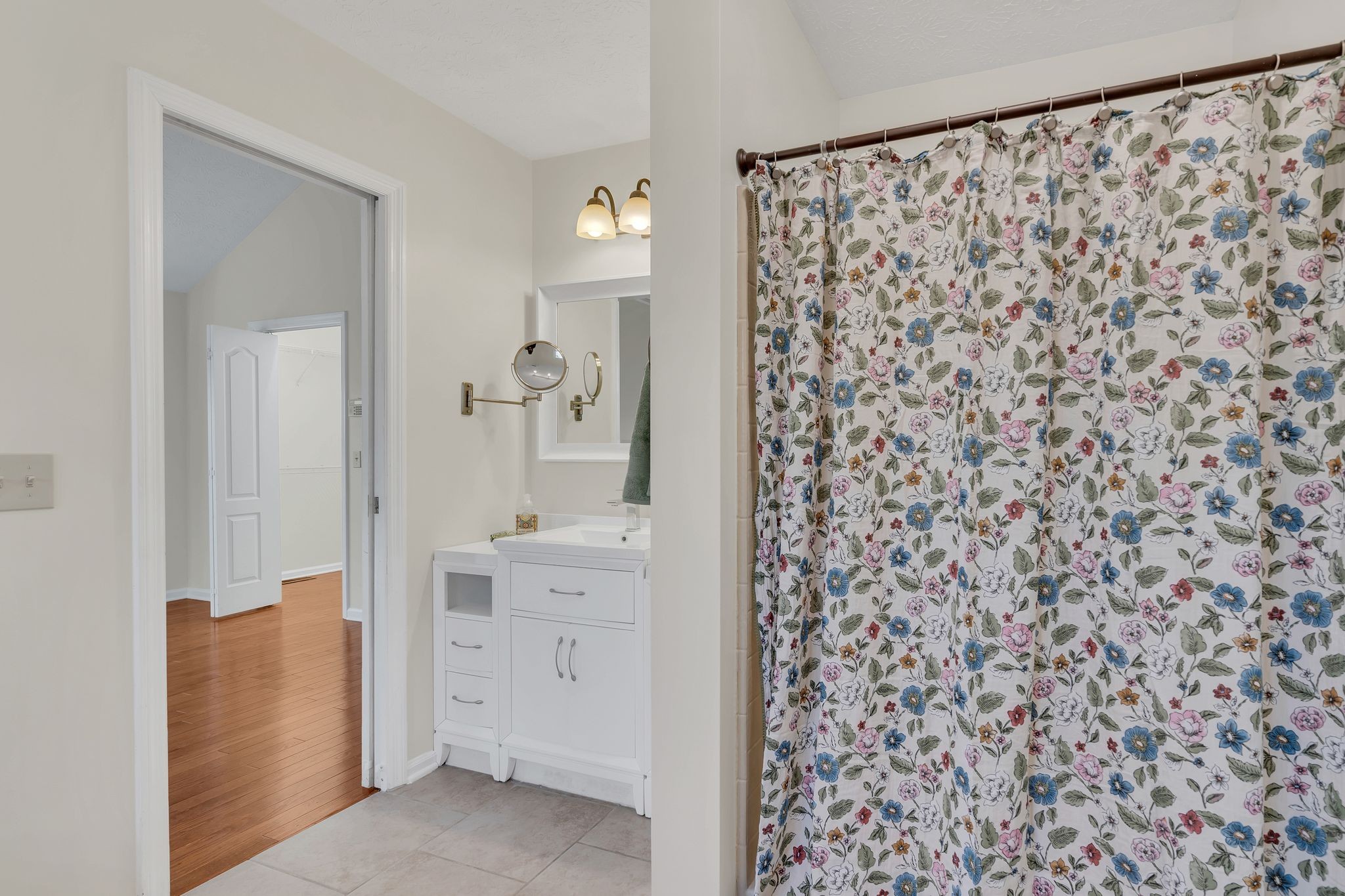 1365 Campbell Ridge Road Kingston Springs, TN 37082 - Photo 19 of 28 a bathroom with a shower curtain and a sink