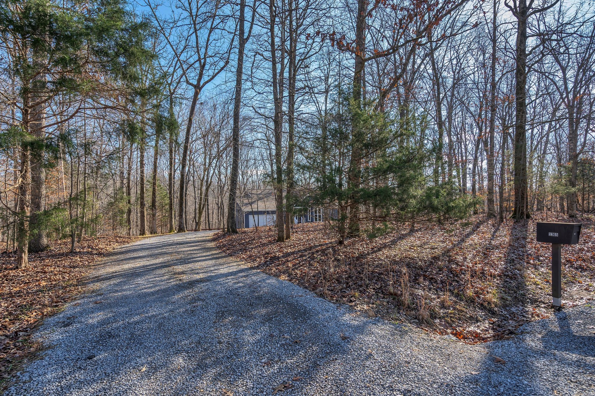 1365 Campbell Ridge Road Kingston Springs, TN 37082 - Photo 2 of 28 a view of a backyard with large trees