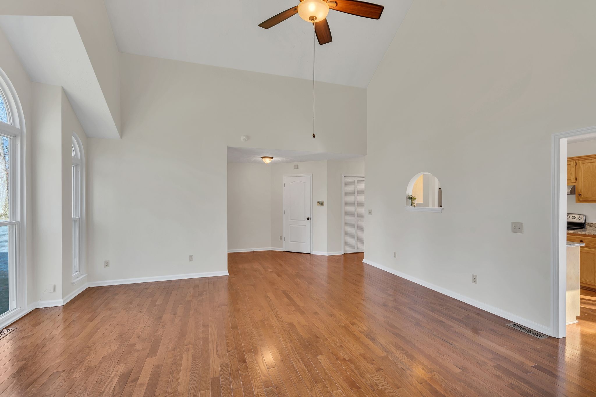 1365 Campbell Ridge Road Kingston Springs, TN 37082 - Photo 9 of 28 an empty room with wooden floor cabinet and windows